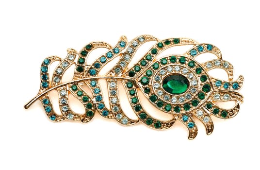 Brooch in the shape of a pen with stones. Isolate on white.