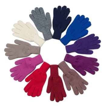 Colored knitted gloves stacked circle on a white background. Isolate.
