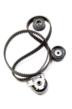 Timing belt, two rollers and the tension mechanism. Isolate on white.