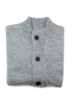 Grey knit sweaters folded on white background.
