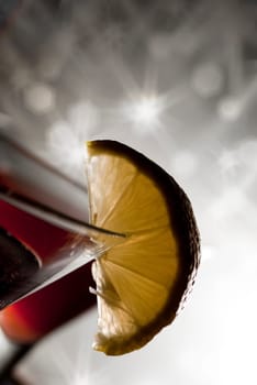 Closeup of martini glass with sparkling background