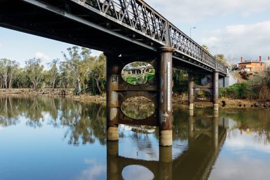 A 19th Centurey steel bridge crossing a large river.