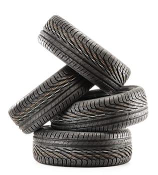 Four new black tires isolated on white background