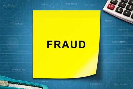 Fraud text on yellow note with graph paper