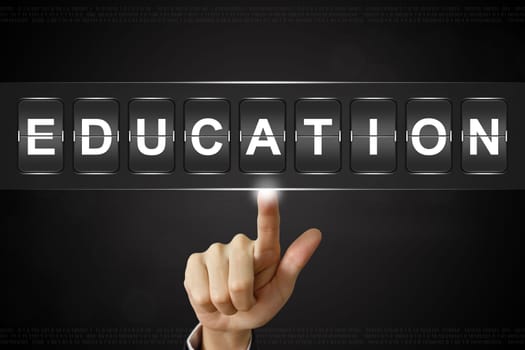 business hand pushing education on Flipboard Display