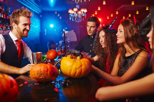 Bartender meeting guests at Halloween night