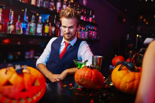 Young bartender at Halloween night