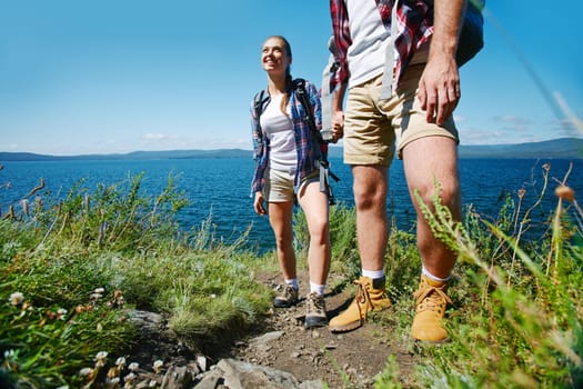 Young travelers hiking in natural environment