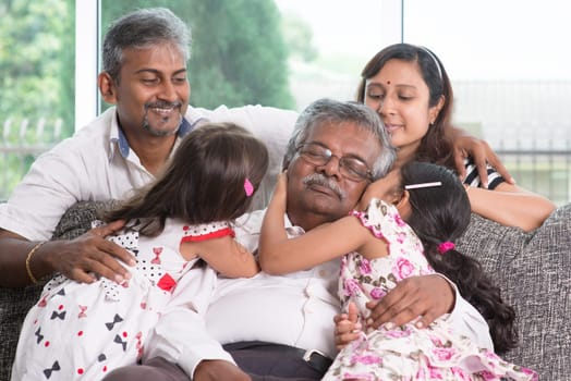 Portrait of multi generations Indian family at home. Asian people living lifestyle.