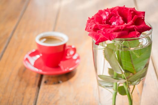 Beautiful table decorated with coffee and red rose, stock photo