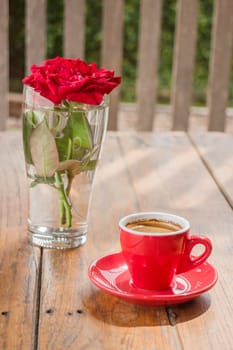 Beautiful table decorated with coffee and red rose, stock photo