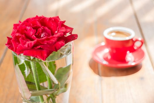 Beautiful table decorated with coffee and red rose, stock photo