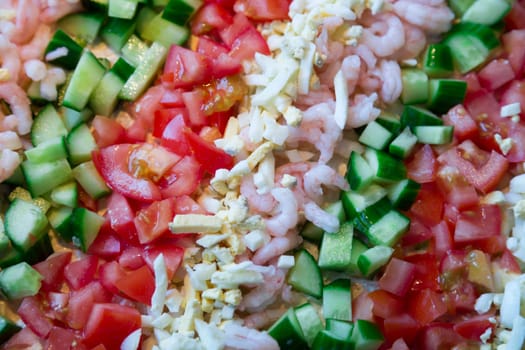 Sandwich layer cake Topping consisting of cucumber, eggs, and tomato.