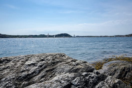 swedish westcoast with boat and sunshine and blue sky
