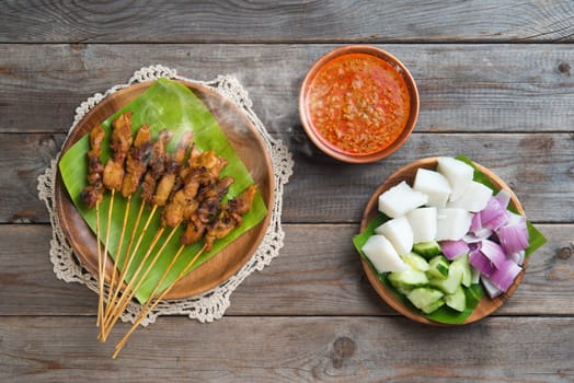 Hot and spicy Asian dish. Chicken sate or satay, skewered and grilled meat, served with peanut sauce. Fresh cooked with steamed and smoke.
