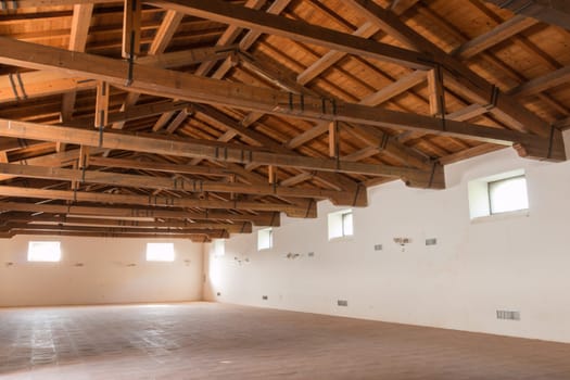 Barn with ancient ruins and roof made of wood