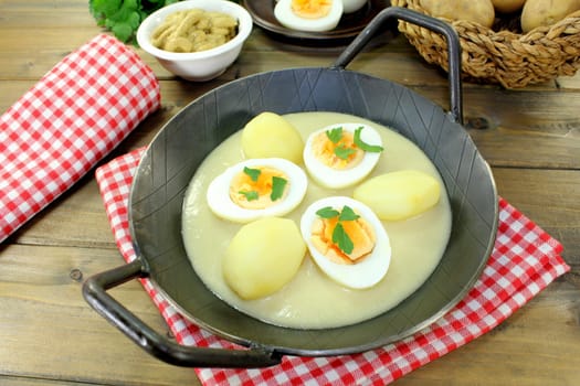 a pan with sauces and potatoes