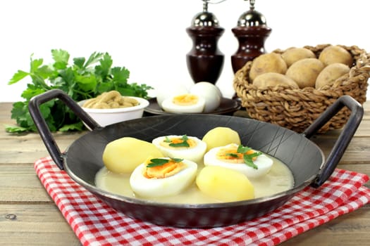 a pan with sauces and potatoes