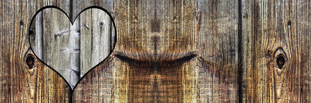 A heart in wood. Background with wood texture