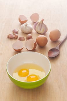 Omelet menu, Egg with garlic and onion on wooden background