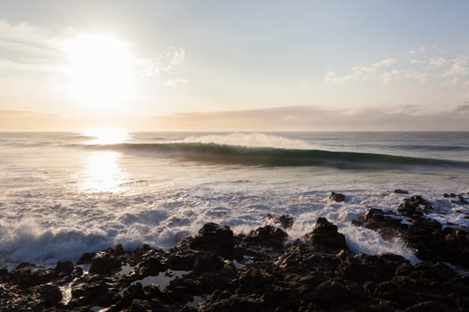 Ocean waves water crashing hollow energy power along rocky coastline.