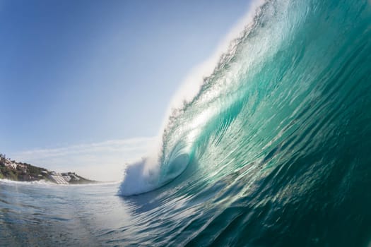 Ocean wave colors of water crashing hollow energy power closeup swimming encounter.