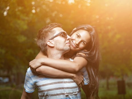 Young happy couple in love having a goot time outdoors