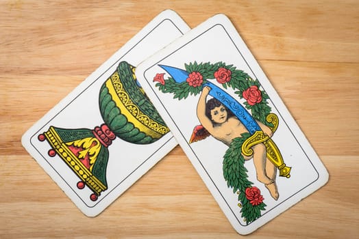 Aces italian card on a wood background