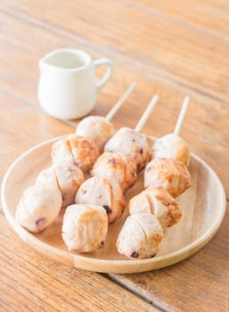 Squid grilled ball on wooden plate, stock photo