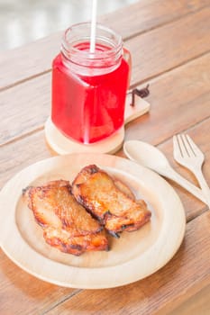Chicken grilled steak on wooden plate, stock photo