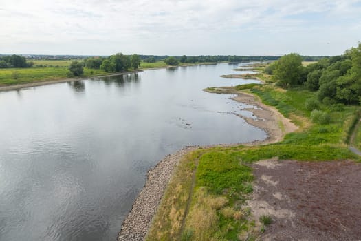 Curved bank of the Elbe with breakwaters and indentations