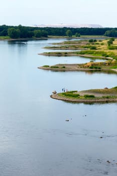 Curved bank of the Elbe with breakwaters and indentations