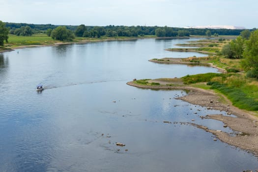 Curved bank of the Elbe with breakwaters and indentations
