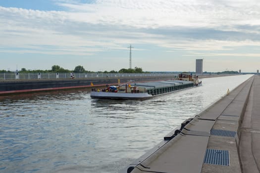 Cargo ship on the bridge of the Elbe-Havel Canal over the Elbe near Magdeburg
