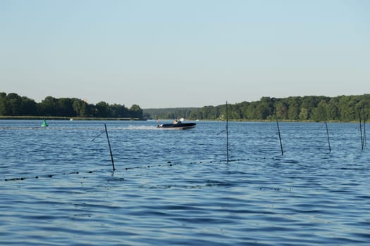 Motorboat at high speed on the Jungfernsee in Potsdam