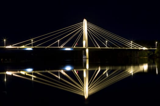 Cable Bridge in Umeå, Sweden. The "Kolbäcksbron"" with the river Umeälv in front."