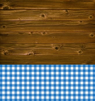 Rustic wooden background with blue white tablecloth pattern