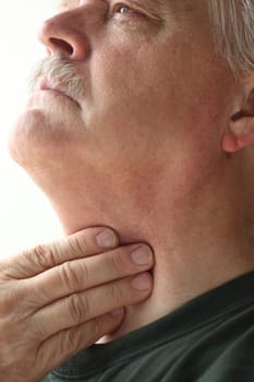 Older man has a problem with swallowing or a sore throat