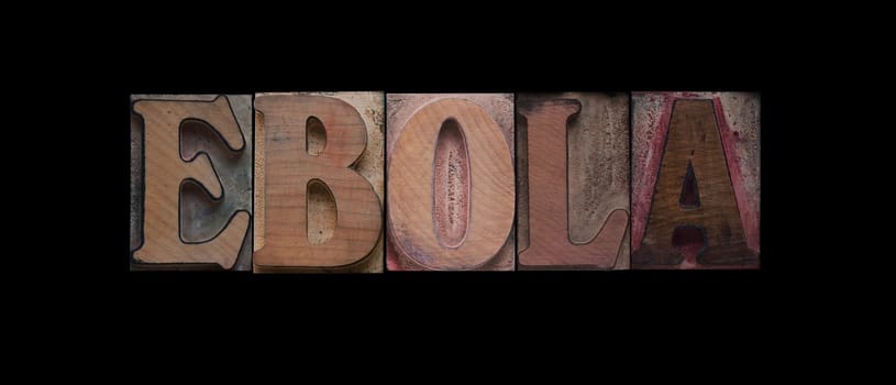 the word 'ebola' in old wood type on a black background