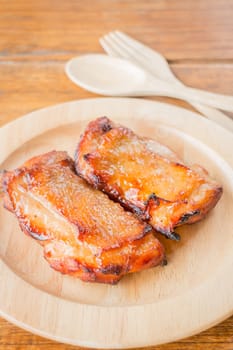 Chicken grilled steak on wooden plate, stock photo