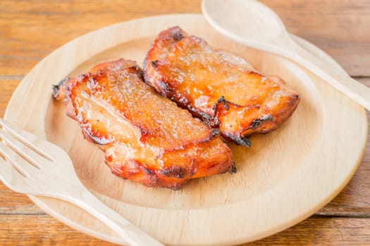 Chicken grilled steak on wooden plate, stock photo