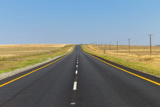 Road Straight highway through the rural countryside landscape