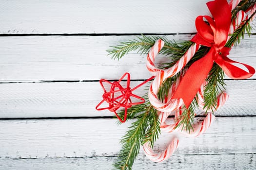Christmas bouquet made up of candy canes, red star and conifer