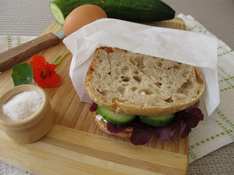 Cucumber sandwich in the takeaway butterbread paper bag