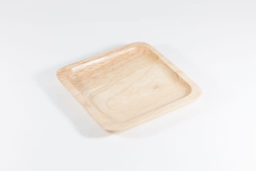 Wooden plate isolated on white background, stock photo