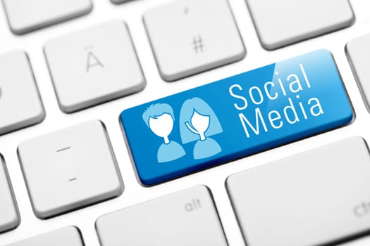 Social media button on white keyboard