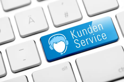 Customer service online button on white keyboard