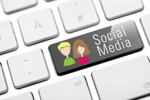 Social media button on white keyboard