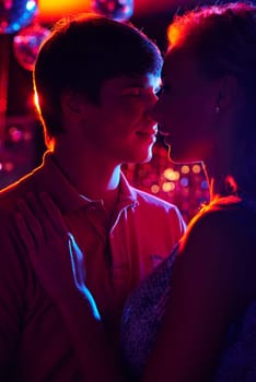 Romantic couple dancing in night club