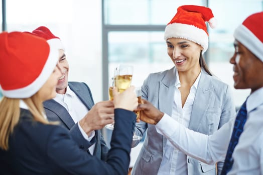 Happy colleagues toasting with champagne
